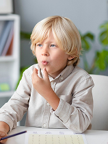 Child practicing oral exercises